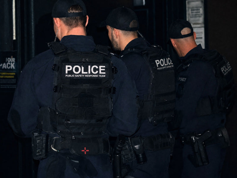 Queensland Police Public Safety Response Team officers on duty, Krieger Micro IFAK visible on the lead officer's belt