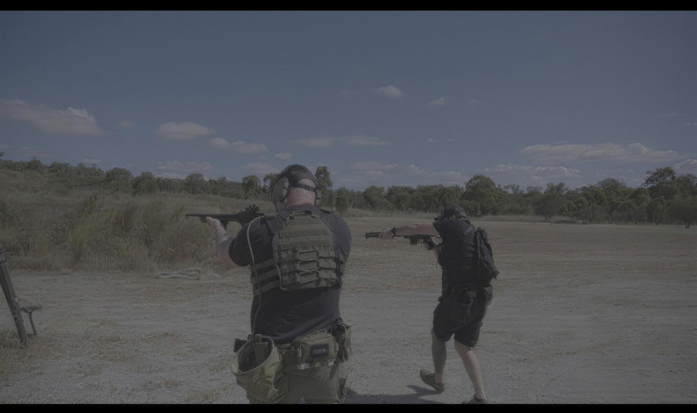 Two shooters in Krieger Industries plate carriers and gear training on an Australian bush firing range